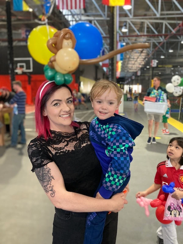 happy mother and her kid with a monkey hairband