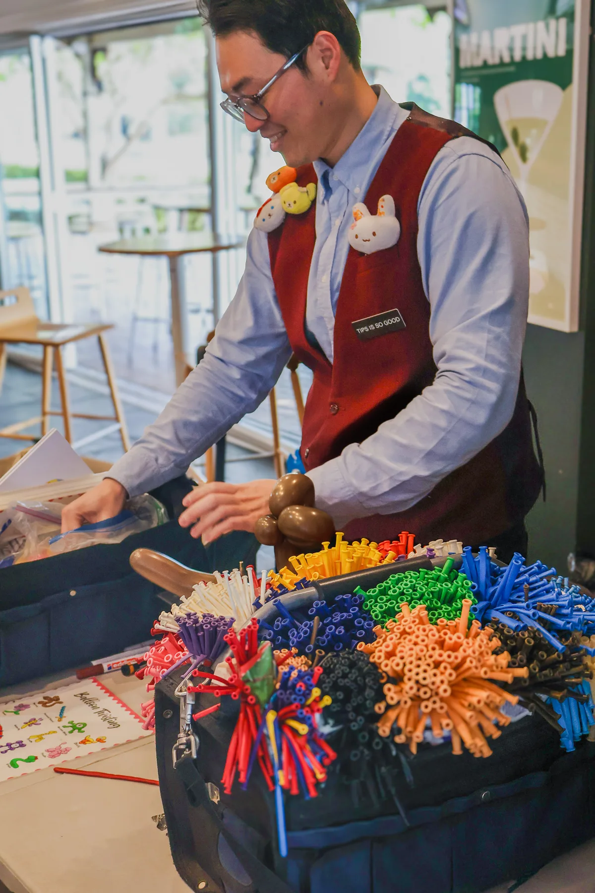 Joy Joe balloon twisting at a Brisbane corporate event