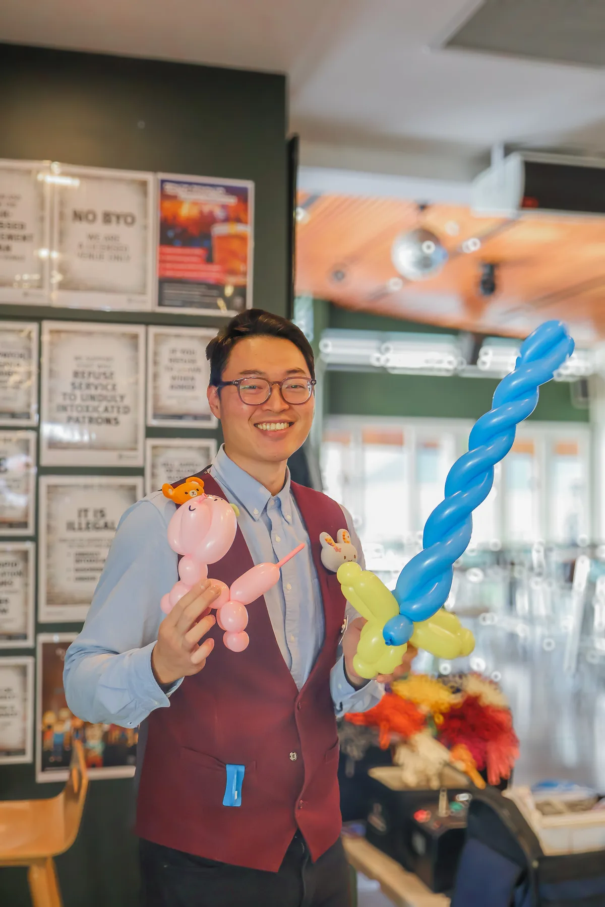 Child receiving a custom balloon creation at a community event