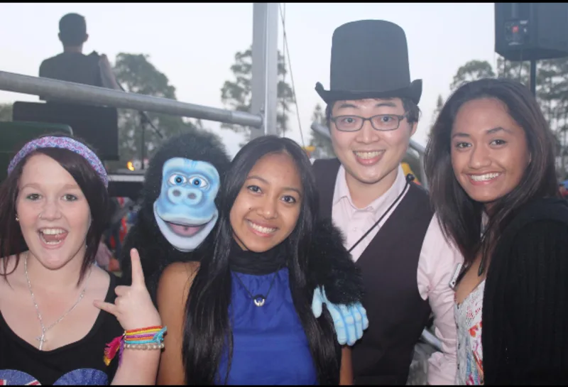 Joy Joe with a child holding a balloon
